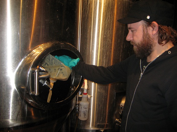 Anders pitching yeast into the fermentor.