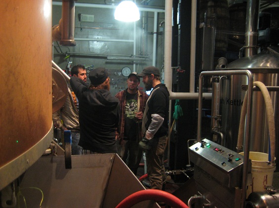 Discussing the progress of the brew.