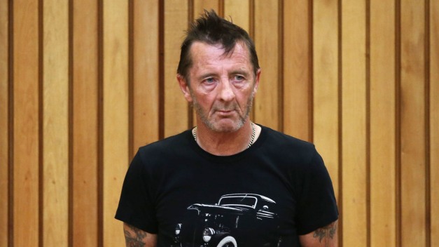 TAURANGA, NEW ZEALAND - NOVEMBER 26:  AC/DC drummer Phil Rudd appears in court after being charged with threatening to kill and possession of meth and marijuana at Tauranga District Court on November 26, 2014 in Tauranga, New Zealand.  Phil Rudd was ACDC's drummer from 1975 to 1983.  (Photo by Joel Ford/Getty Images)